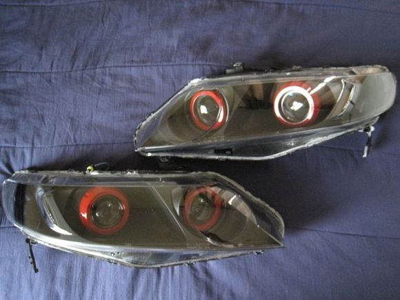 06-11 civic sedan

quad morimoto mini h1 projectors
quad type k shrouds
reflectors, back of shrouds, turn signals painted black
front of Shroud painted red