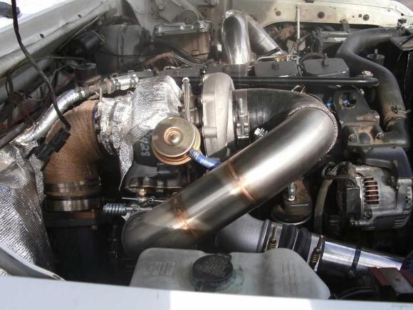 Compound turbo setup.   It's a 57/65/14 S300 over a modified HT3B.   Good for 650 whp, if you have the fuel.   For my truck... 400-450 whp.