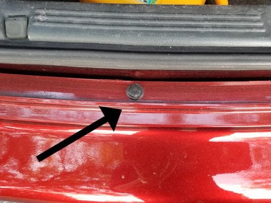 This is 1 of 2 "screw" type or "snap through" things holding the bumper on