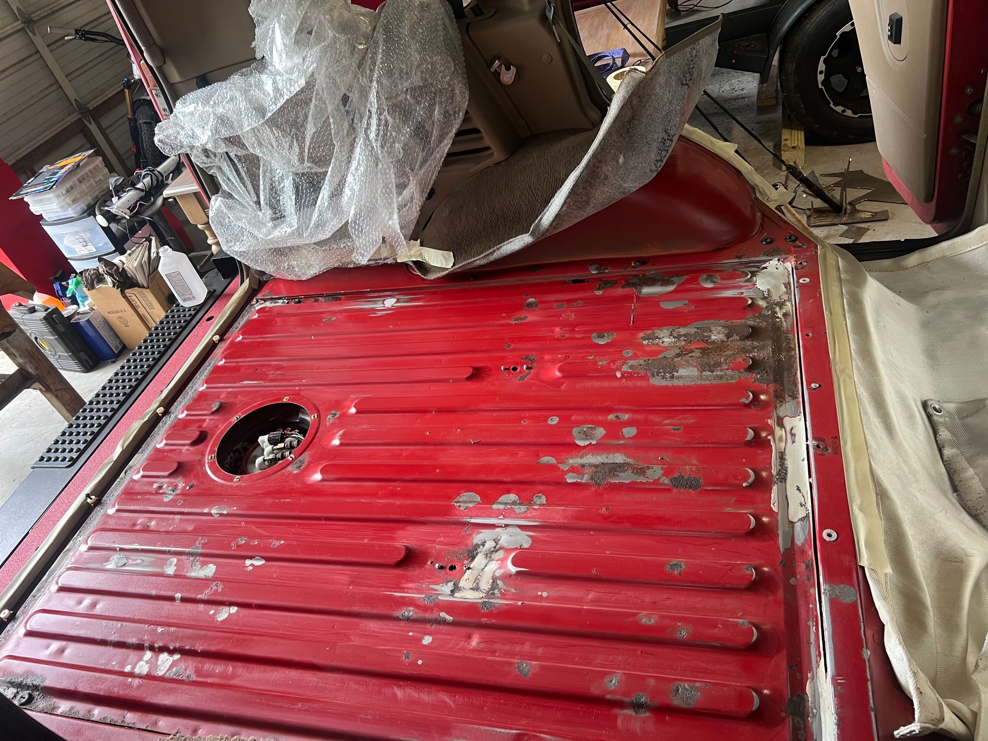 A very shoddy job at fixing the rust without replacing the entire section. To break up the monotony of fixing the drivers seat area 