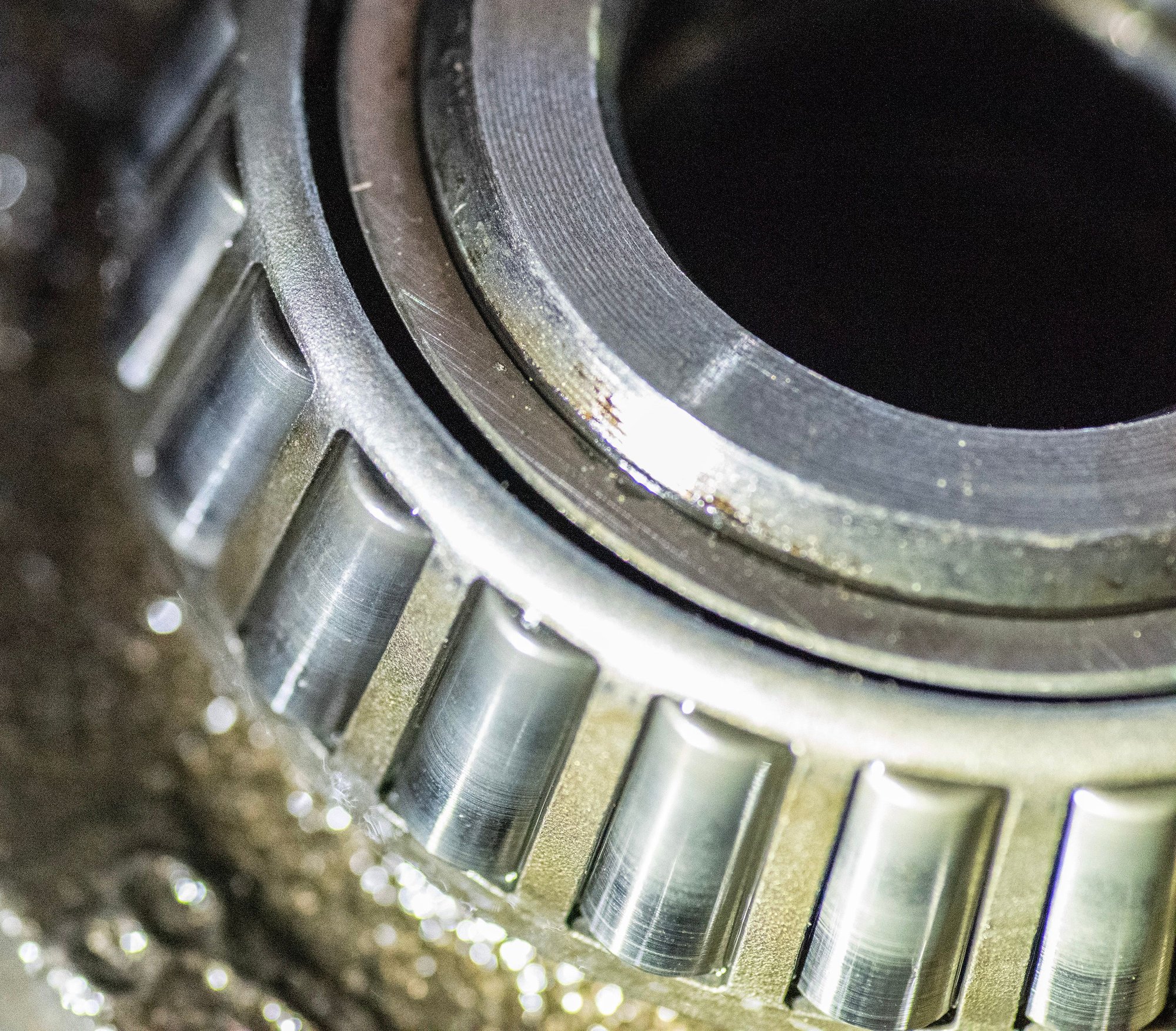 Passenger side bearing is worn but not damaged.