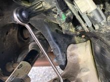 The anchor pin is at the bottom.  The plastic arm is coming from the potentiometer -- fragile  The Johnson rod connects the arm and anchor pin