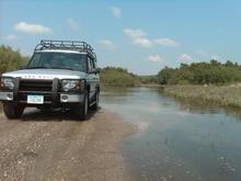 We just came out of the water behind us.  I was about 100 yards long and got up to the middle of the headlight (I didn't want to stop for a photo-op).  The Disco handled it fine and once I get the lift, tires, and the snorkel I am sure I will be back during the rainy season.