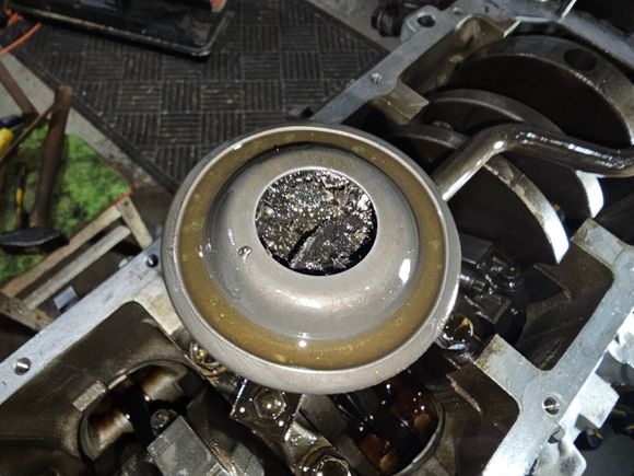 Oil pickup strainer is completely clogged. Glad I am pulling this thing apart. I noticed remnants of what looks like head gasket material. Hoping the internals are fine. Previous owner said it ran well and was quiet. Can't imagine the oil pressure was that great!