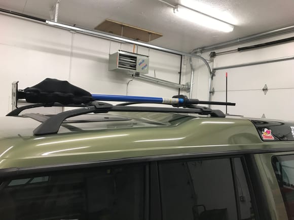 I bolted a high lift up in the factory cross bars, and got a cheap neoprene cover to keep it good
