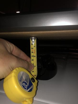 2" from top of shark fin to a piece of weighted cardboard sitting atop the roof-rack. 