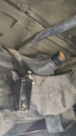 Step 12 Remove the Nut and bold of the right hand side (passenger side) of the fuel tank strap
