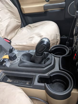 Put a Discovery 3 manual shift gaiter on it to avoid the plastic clatter when using the command shift