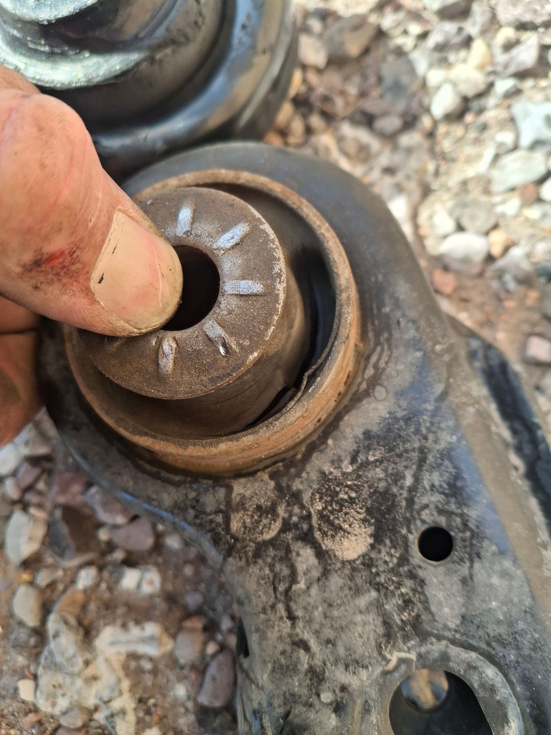 1 year old torn drivers side control arm bushing, manufacturer using garbage rubber.