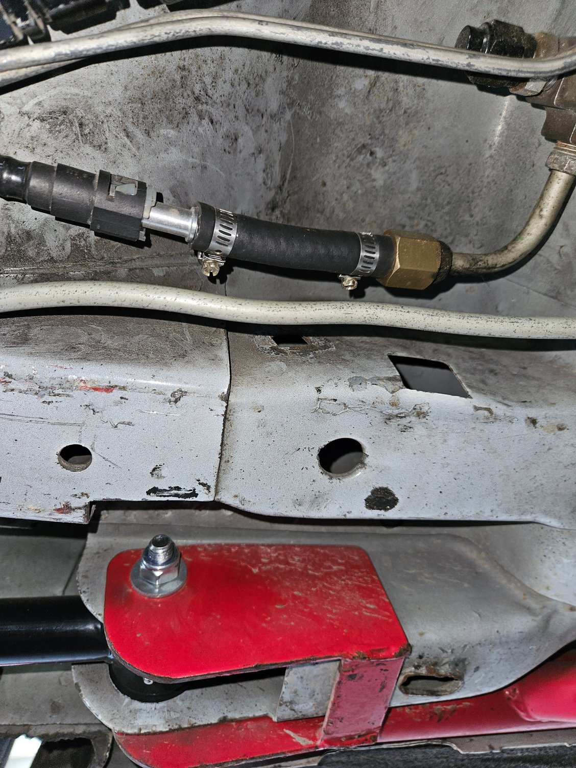 OEM fuel filter removed and fuel hose and fittings in place