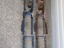 The Ospho treated coupe’s dash skeleton on the left and the bare, rusted donor skeleton.