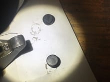 tops of both lash caps.  wondering why the paint is 100% cleaned from the top. no real wear. odd shaped circles tho.  could be from the manufacturing process.  i had 1 new cap leftover. paint inside and out and no circles.