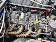 You can see the circled rubber cap on the intake manifold port. And if you look closely here, it looks like the breather on the throttle body was removed as well and plugged…