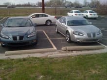 lil side by side with another GXP in the lot...my grilles in this pic are the same as the other GXP from factory just painted silver to match...this was before my insert kit