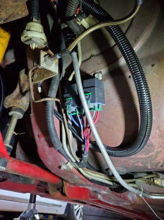under the car is pretty simple. everything goes  as he says. i used some self tappers on the relays and used the existing bolt for the brake bracket for the grouns