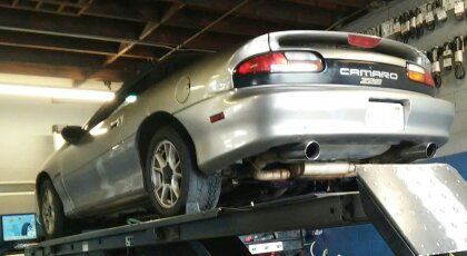 Getting aligned after a slew of poly bushings, upper/lower ball joints, outer tie rod ends, etc.  The first pic that shows off my rear midsection painting & rebadging prowess ;b