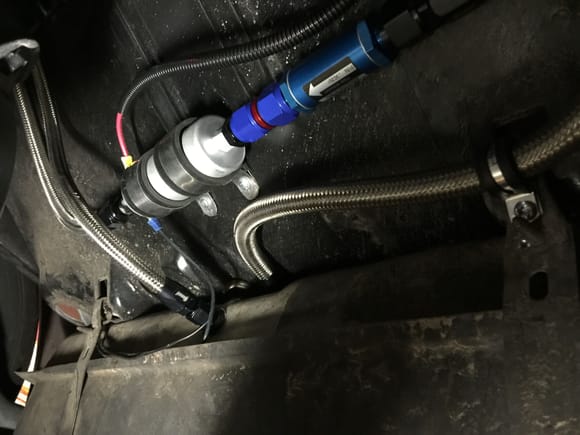 Took the sump type thing out of tank, welded new 1" stainless pipe 90'd towards driver side in tank. Had a stainless AN elbow fitting welded to pipe coming out of the tank. Return is just -6 with a nut on back. Custom made straps out of stainless scrap we had at work. Walbro 255 pump.