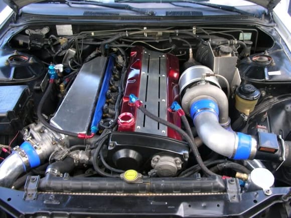 Rb25 with a Top Mount Garret 60-1, 680cc Injectors, Custom Made Intake Manifold, Q45 90mm Throttle Body.