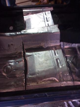 Floor coated in sound deadening material