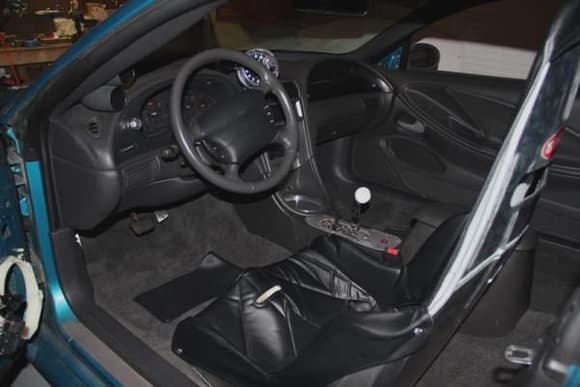 New carpet, mostly 04 Mustang charcoal interior, Holley gauges, airbag deletes, Kirkey race seat.