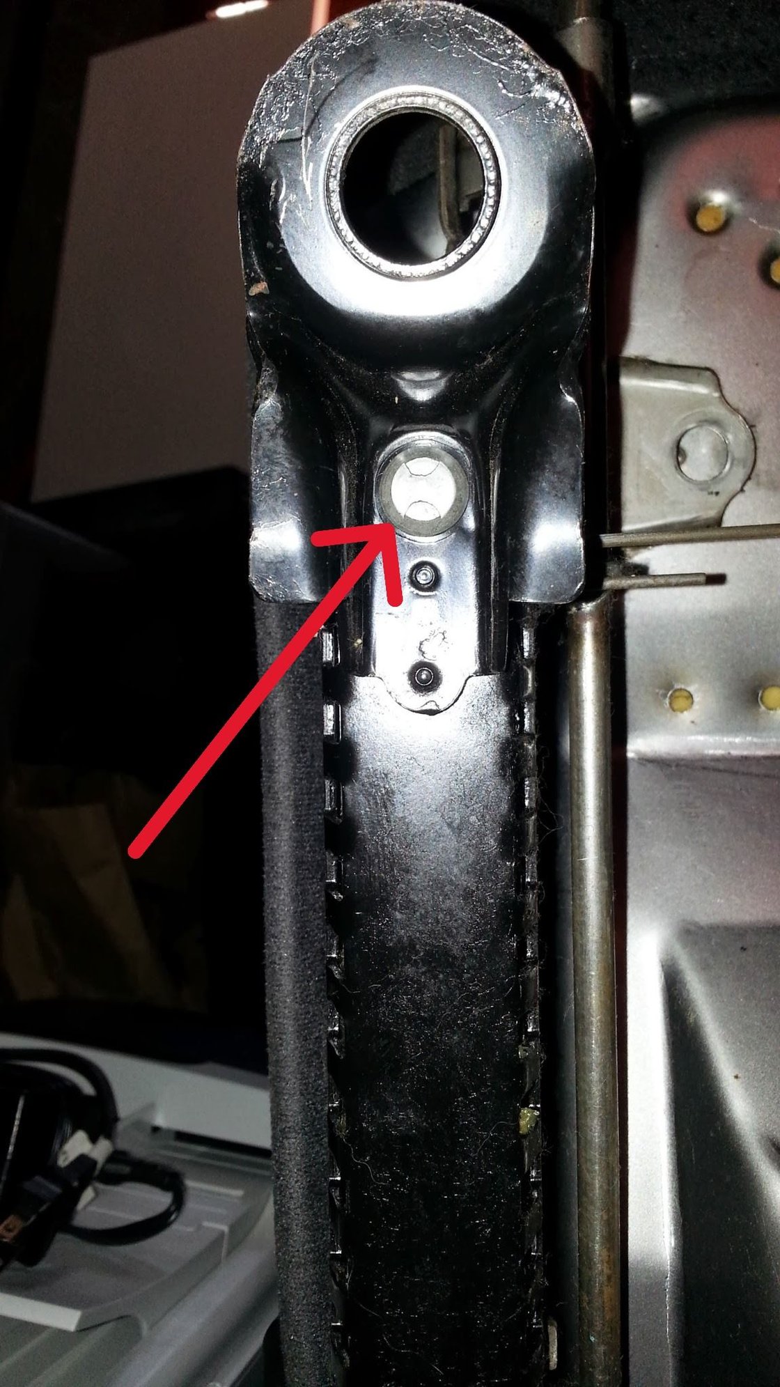 Front of the rail, aluminum piece keeps from sliding out.