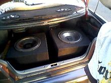 2 12" dual 400 watt subwoofers In 2 single sealed boxes. Right sub repaired with sealer on the rubber cone surround screw driver went through it wile mounting 1st 10 min I had it I was pissed. Very small though and doesnt effect sound quality or proformance at all.