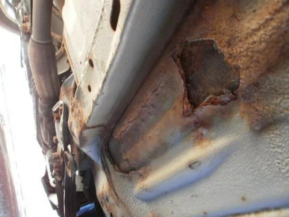 I've got this big hole in the passenger side I need to figure out how to patch. If it can even BE patched.