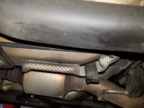 Help! I noticed oil on my driveway and when I got under the car and looked - the black "stick" like part is dripping oil. Does anyone know what that part is so I know where to start?