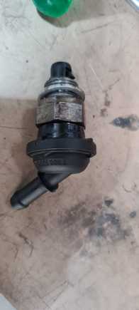 This is the faulty valve. It is attached to a hose. And this goes from the block to the intake. Crankcase vent hose which incorporates the valve.