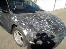 sanding down and filling in dents
