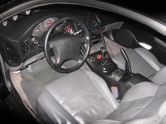 interior after car broken into.  got all the gauges head unit amp sub and they smashed the window on the one night i wasnt home and it down poured... what a mess...jealous people are dicks go get a job and work hard for your own stuff dont steal and destroy what people have worked hard for