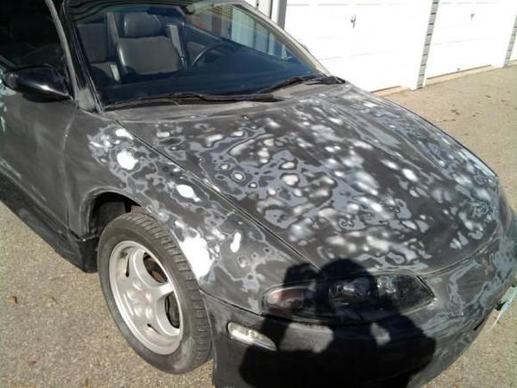 sanding down and filling in dents