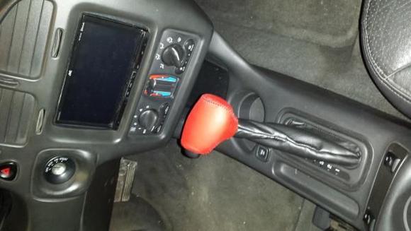 Pace car red leather gear shift.