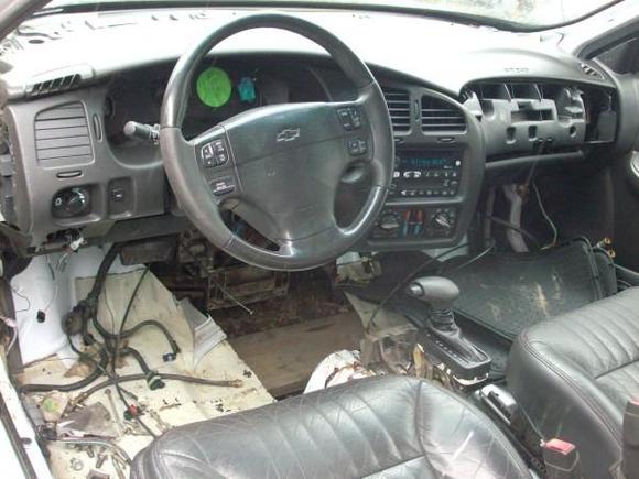 I removed the dash, removed the factory HvAc unit, then reinstalled the dash for transmission fitting purposes.
Note the shortenned -factory- gear shift?
Of course the -new- transmission tunnel will require more height.
I'm pulling all the interior out when I get it back to the shop after the winter vacation.
Once back in the shop I'll be getting the pedals in order. I have to move the brake pedal over two or three inches, making room for the electric throttle pedal.