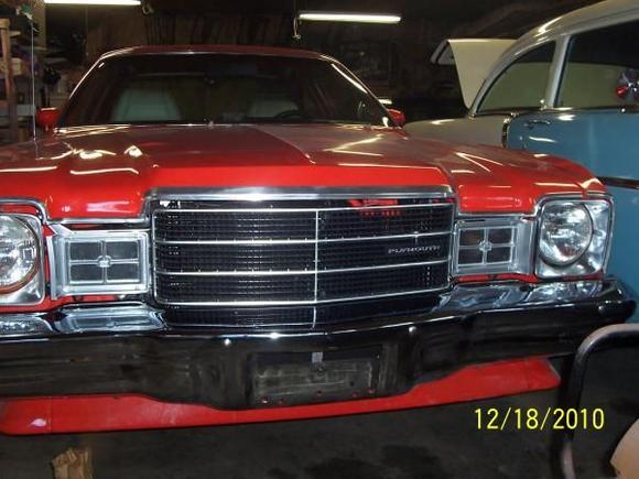 I installed the new grill. I also reinstalled the chrome moldings. I had a local guy  polish all the molding.