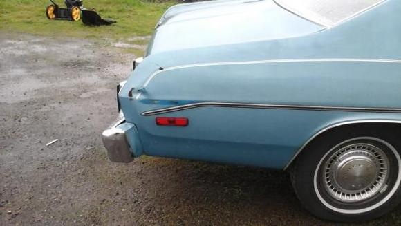 Small ding in the passenger rear quarter.