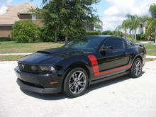 Front has Roush Grille with factory fogs custom mounted behind.  Also added the tri-bar.  It also has the Ford Style Hoodscoop and CDC front Spoiler