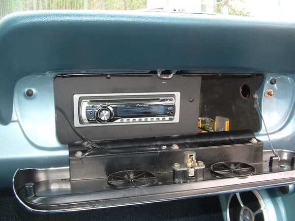 I made a plate to hold the Pioneer CD Unit in the glove box.  It uses a IR remote control so it can be changed with the glove box door closed.