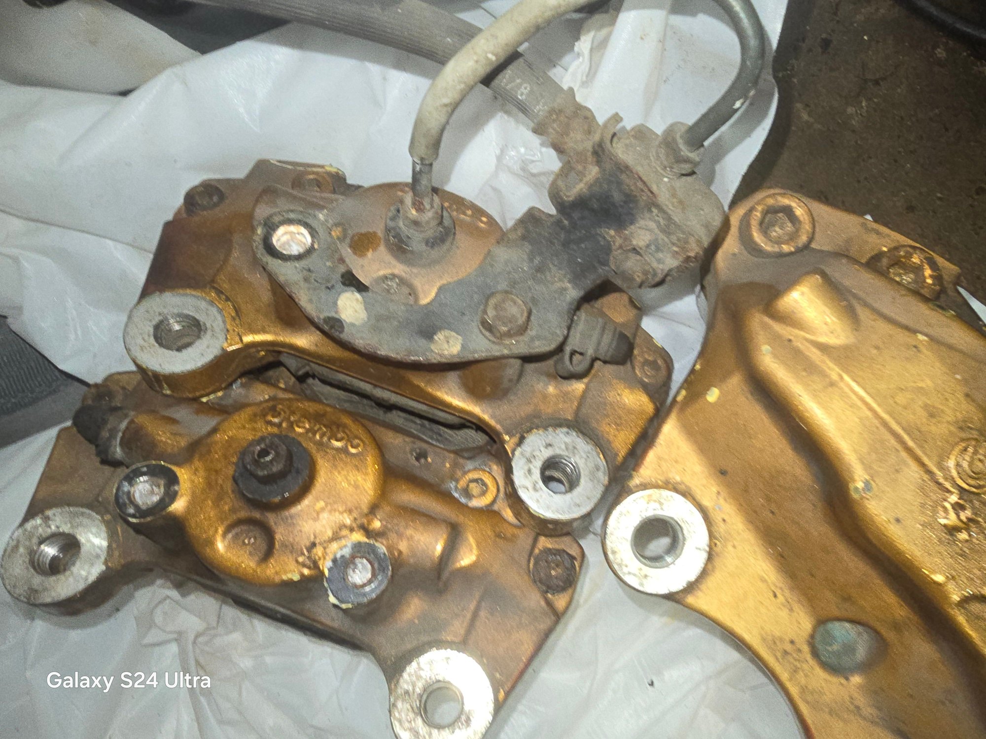 Anyone in NY area who wants a free brembo caliper set with hardware up for graves worked perfect for me until It came time to rebuilt seals and repaint them, have all 4, front two seals good all threads are good but can't open one bleeder screw, the rear 2 seals are good,  brake line bracket mount threads for OEM lines also need to be rethreaded or just use stainless steel lines. My loss is your gain.