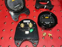 Gauge mounts to install aftermarket gauges where oem center triple pod goes