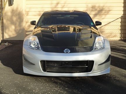 As much as I liked the look of the carbon fiber lip on the front bumper, the whole car flows better with it painted!