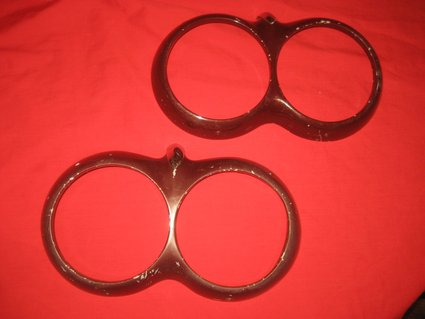 1961-1962 Corvette pair of used headlight bezels.