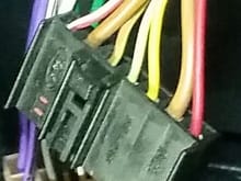 Working from the left of the plug (ford logo end) can anybody inform me of the cables job/output please.

3rd cable from the left interests me the most as the splitter from this plug to the radio & cd player has it missing.