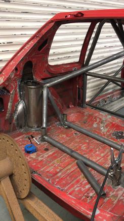 A couple more pics of the rear cage work, Mark is making the fuel cell to fit in the gap between rear seats with tabs so we can put a fire wall over it.