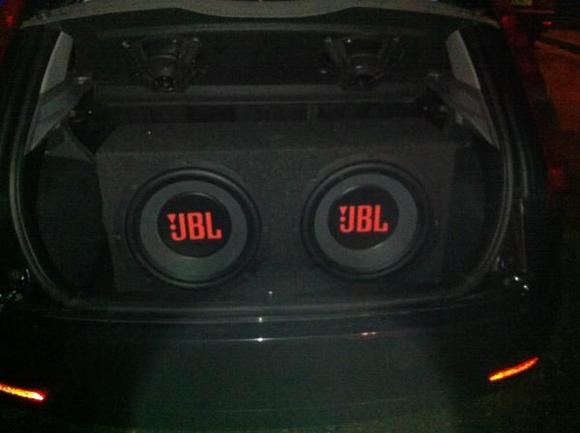 My twin 15inch JBL subs (taken in the dark of course). 
I have only 3inch's free space in my boot now.