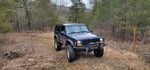 Jeep Jam Best-in-Class winner 99 Cherokee SE 2D 5spd.