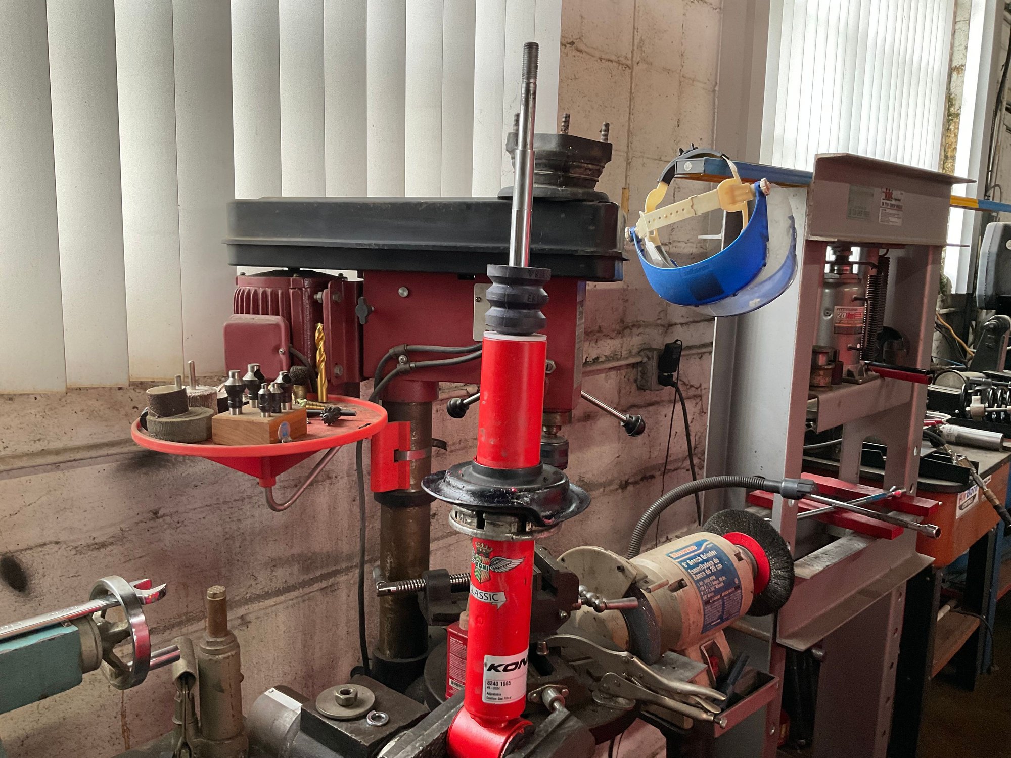 Shock and lower perch with rubber bumper