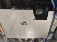 Oil filter and drain plug access holes perfectly placed