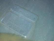 A few tiny metal flecks at the bottom of my drain pan. 