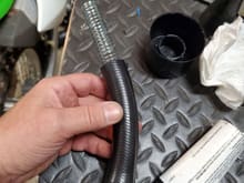 Used some scavenged AOS hose ends to make the hose that will connect to the OEM AOS outlet.  Because it will have a bend in it and I don't want it to kink, I installed a spring into the hose.  This also prevents collapse under vacuum.